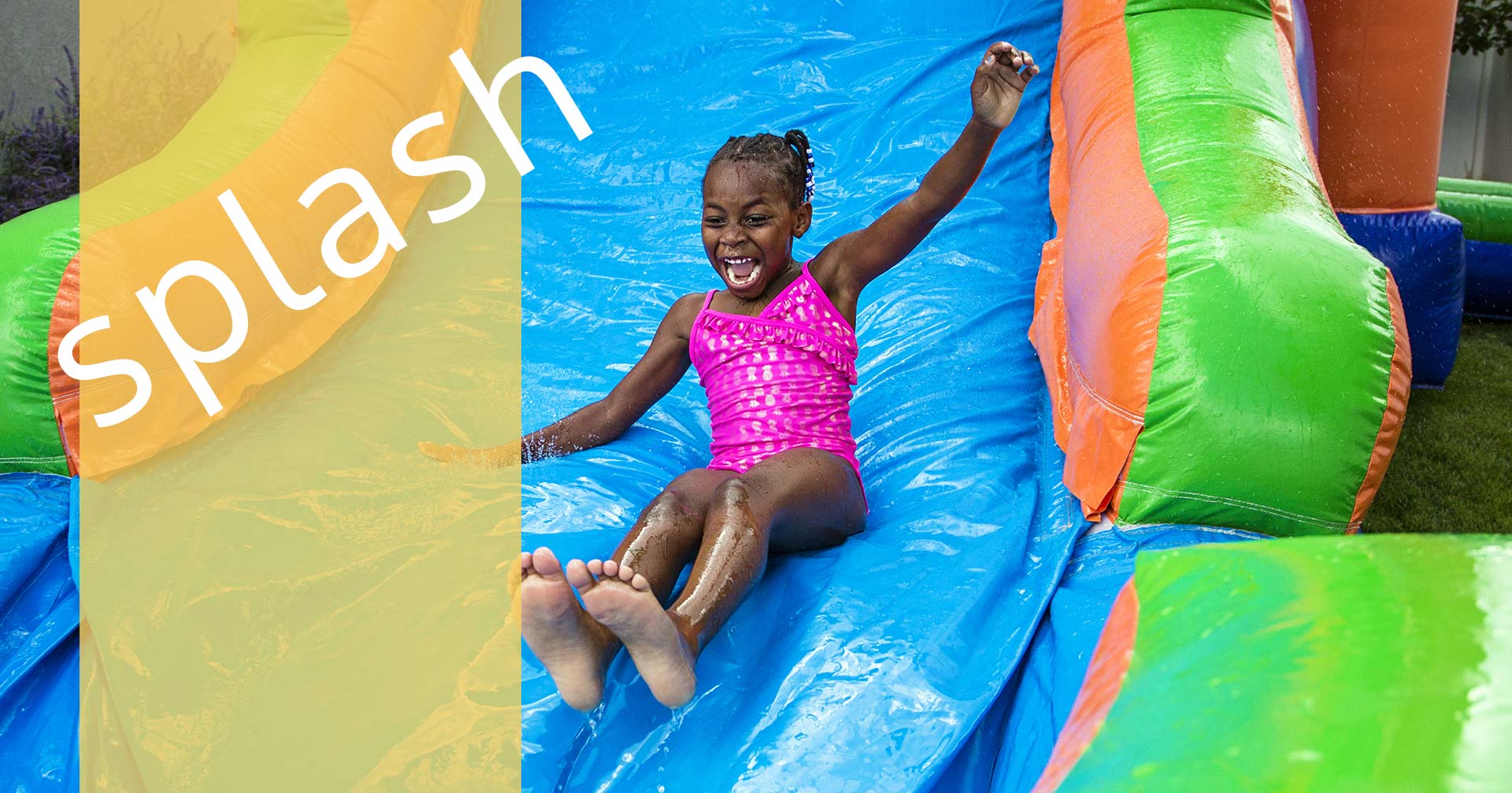 happy girl on inflatable waterslide